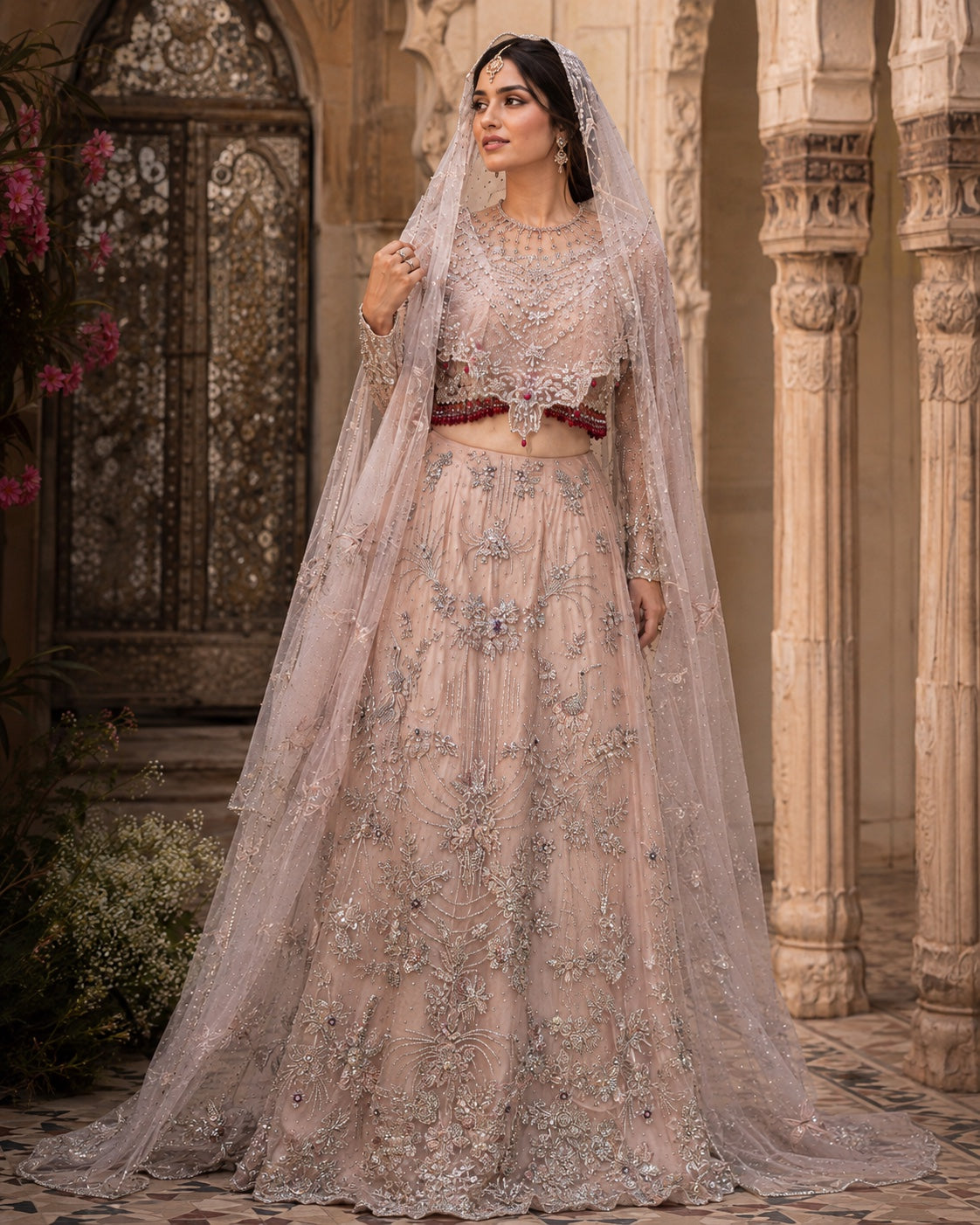 Blush bridal lehenga with silver embellishment and veil