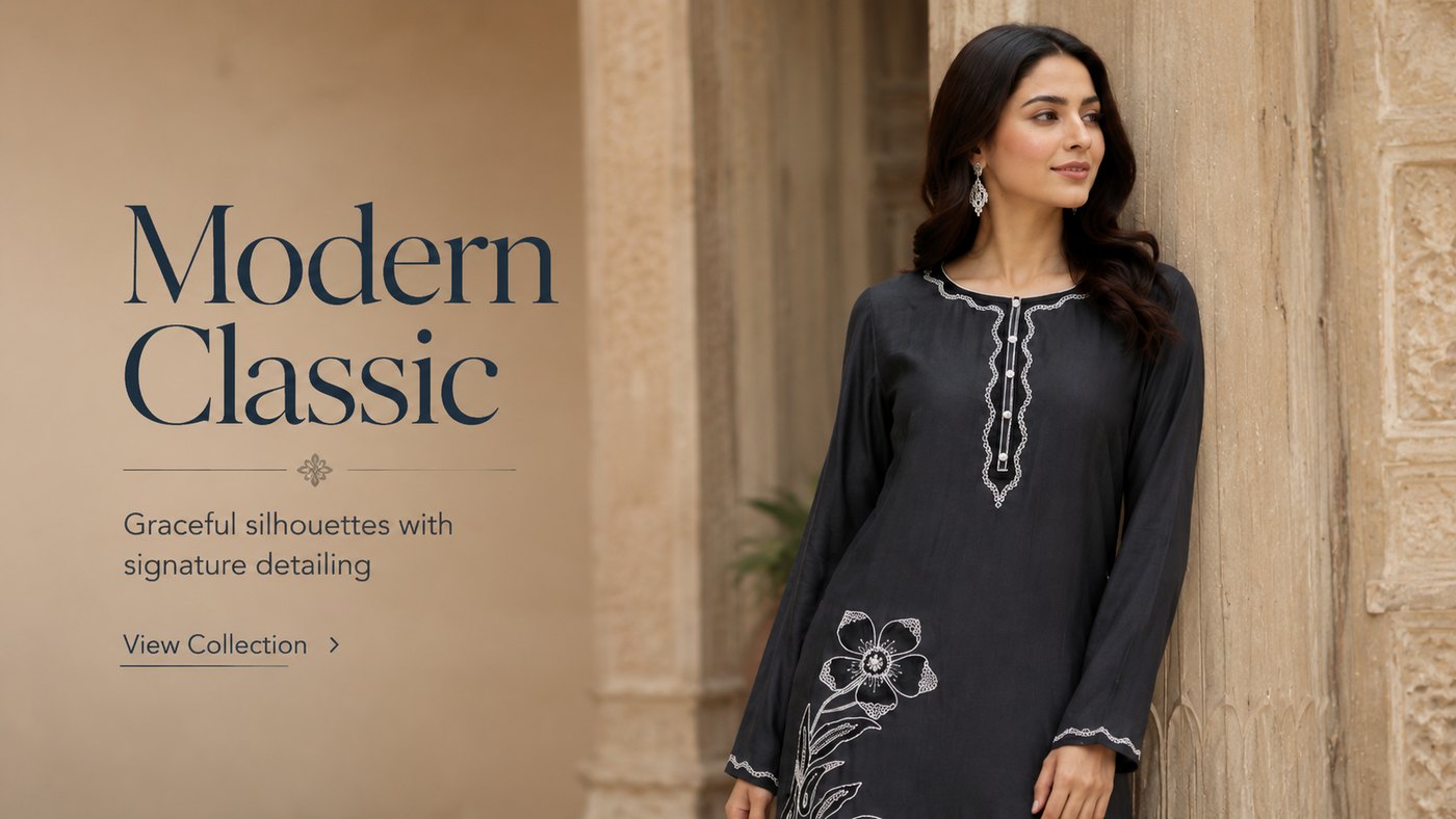 Model in a black Pakistani kurta with white floral embroidery